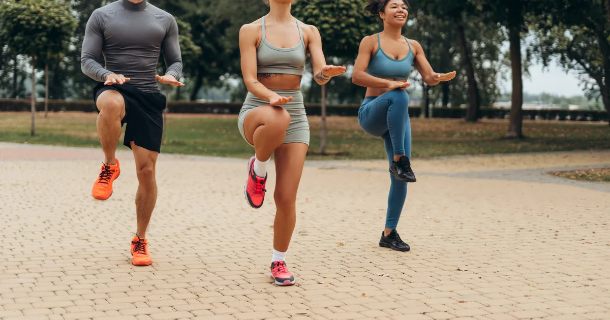 Group of people exercising outdoors in a city park